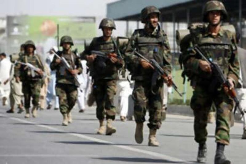 Afghan national army soldiers patrol the streets of the capital.