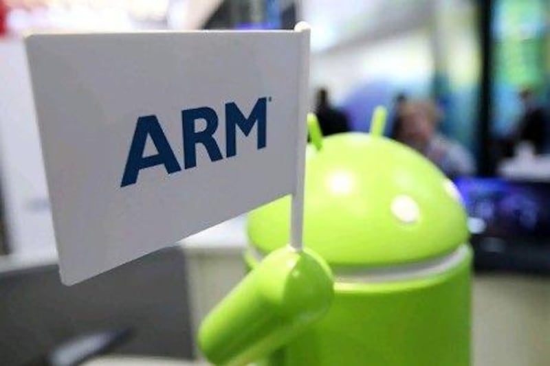 An Arm Holdings Plc logo is held by an Android operating systems robot at the Mobile World Congress in Barcelona, Spain, on Thursday, March 1, 2012. The Mobile World Congress, operated by the GSMA, expects 60,000 visitors and 1400 companies to attend the four-day technology industry event which runs Feb. 27 through March 1. Photographer: Chris Ratcliffe/Bloomberg