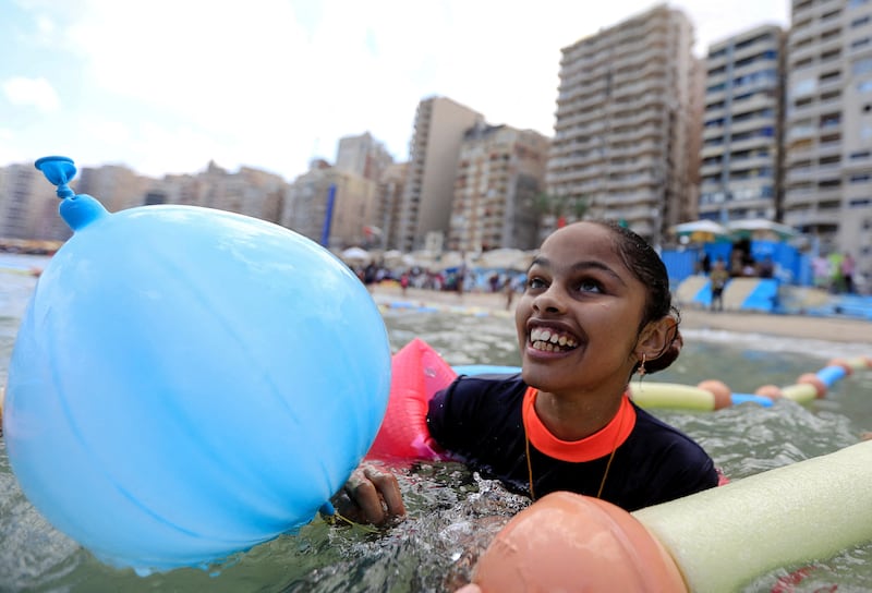 Farah Mohamed, 12, a visually impaired child, enjoys the water at Al Mandara beach, the first 'beach for the blind' in Egypt, on the Mediterranean coast in Alexandria. Reuters