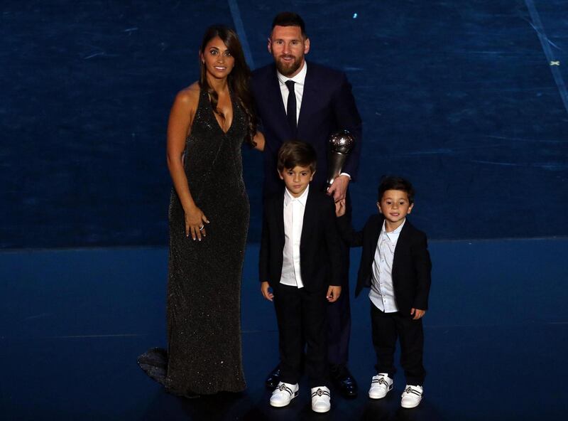 Lionel Messi poses with his family during the Best FIFA Football Awards.  EPA