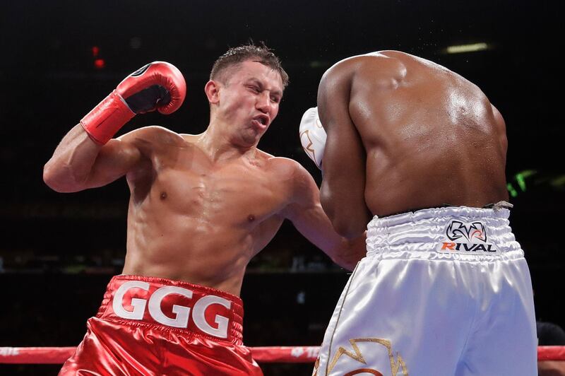 Kazakhstan's Gennady Golovkin, left, punches Canada's Steve Rolls during the fourth round of a super middleweight boxing match Saturday, June 8, 2019, in New York. Golovkin won in the fourth round. (AP Photo/Frank Franklin II)