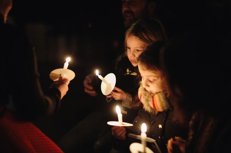 Candles are lit during the Singing for Syrians Carol Service in St Margaret’s Church, Westminster, in 2018. Courtesy Hands Up Foundation