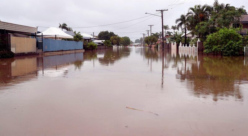 Houses sit in floodwaters. AFP