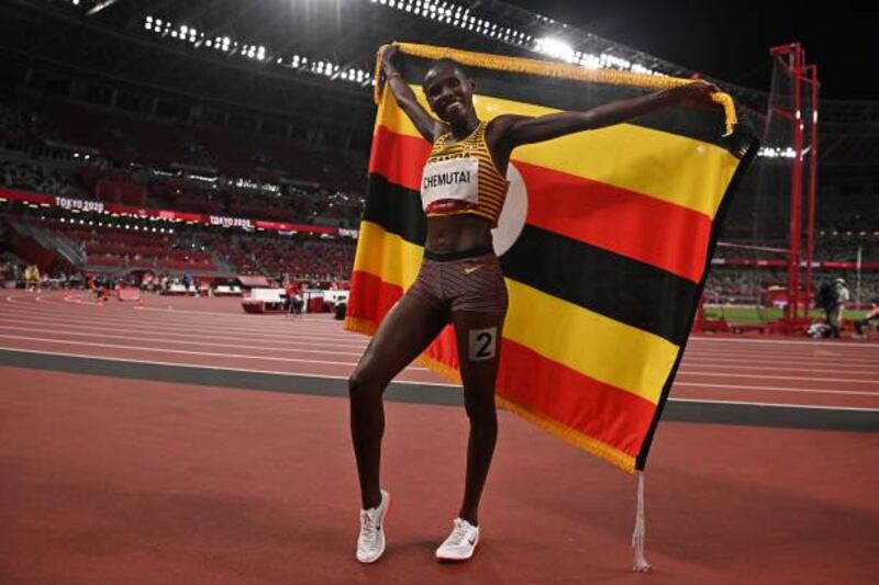 Uganda's Peruth Chemutai celebrates after winning gold in the women's 3000m steeplechase.