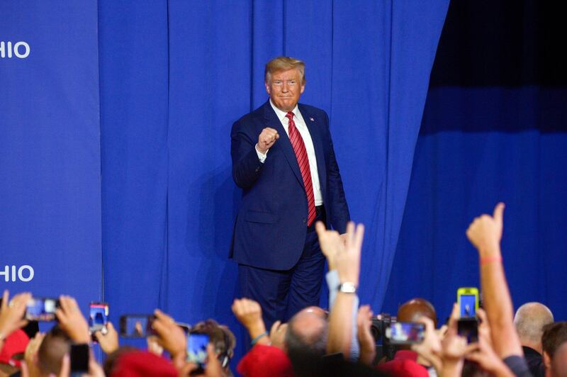 U.S. President Donald Trump gestures as he stands on stage during an event at Pratt Industries in Wapakoneta, Ohio, U.S., on Sunday, Sept. 22, 2019. Trump escalated attacks on his main Democratic rival Sunday even as he faced continued questions over his discussions with Ukraine’s president about Joe Biden. Photographer: Dustin Franz/Bloomberg