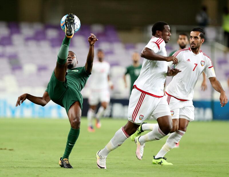 Al Ain, United Arab Emirates - August 29th, 2017: UAE's Ahmed Khalil (M) and Saudi's Omar Ibrahim Othman during the World Cup qualifying game between UAE v Saudi Arabia. Tuesday, August 29th, 2017 at Hazza Bin Zayed Stadium, Al Ain. Chris Whiteoak / The National