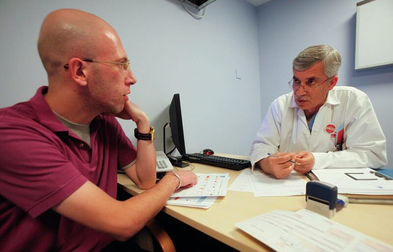 Dr Hussein Abu-Khudair receives a cancer patient in his clinic at the King Hussein Cancer Centre (KHCC) in Amman, Jordan. (Salah Malkawi for The National)