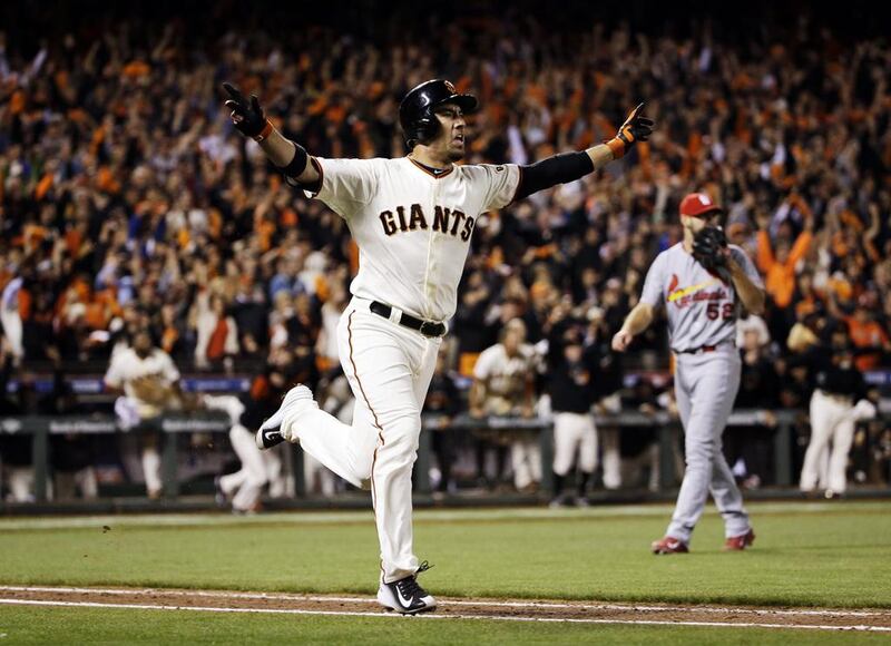It was not one of their All-Stars but journeyman Travis Ishikawa, top, who delivered the big hit for the San Francisco Giants. David J Phillip / AP Photo