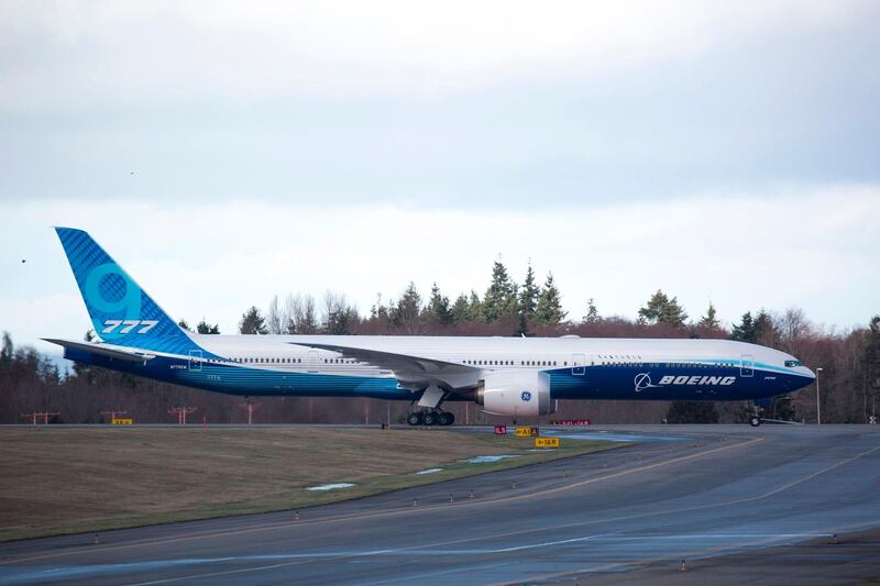 The Boeing 777X airplane taxis back after postponing its first flight due to weather conditions at Paine Field in Everett, Washington on January 24, 2020. AFP