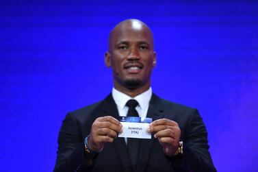 Former Ivorian striker Didier Drogba shows the ticket of Juventus during the Uefa Champions League draw. EPA