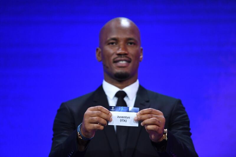 epa08713148 A handout photo made available by the UEFA of former Ivorian striker Didier Drogba showing the ticket of Juventus FC during the UEFA Champions League 2020-21 group stage draw in Geneva, Switzerland, 01 October 2020.  EPA/Harold Cunningham / UEFA HANDOUT  HANDOUT EDITORIAL USE ONLY/NO SALES