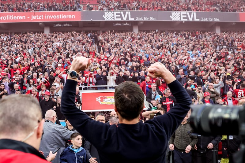 Leverkusen's head coach Xabi Alonso salutes the fans. EPA