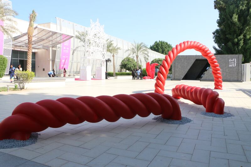 The outdoor installation is created from a series of four sculptures that bears a resemblance to a piece of thread or woven rope
