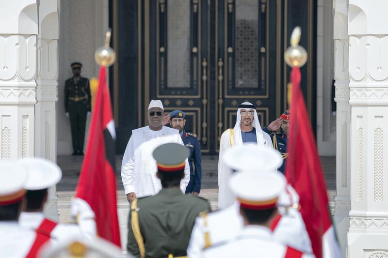 ABU DHABI, UNITED ARAB EMIRATES - February 06, 2020: HH Sheikh Mohamed bin Zayed Al Nahyan Crown Prince of Abu Dhabi Deputy Supreme Commander of the UAE Armed Forces (centre R) and HE Macky Sall, President of Senegal (centre L), stand for the national anthem during an official visit reception, at Qasr Al Watan. 

( Rashed Al Mansoori / Ministry of Presidential Affairs )
---