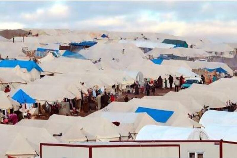 Displaced Syrian refugees seen at a makeshift camp set up along the Turkish border close to the village of Atme in the northwestern province of Idlib. Courtesy AFP