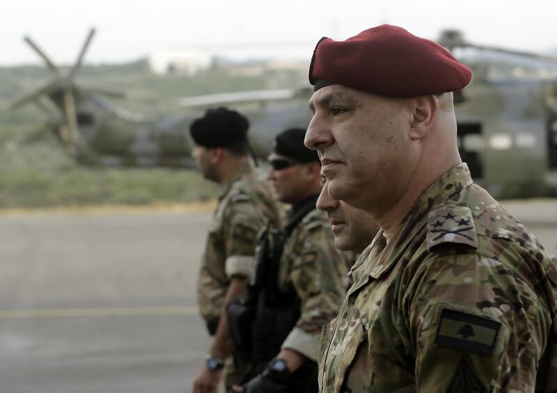 General Joseph Aoun (R), the Lebanese Army Chief of Staff, arrives to attend a handover ceremony organised by the Lebanese Armed Forces of four A-29 Super Tucano aircraft given by the US at Hamat airbase, north of Beirut on June 12, 2018. Lebaneon received the second lot of four A-29 Super Tucano aircraft on June 12, from the US government, in its bid to assist the Lebanese armed forces. / AFP / JOSEPH EID
