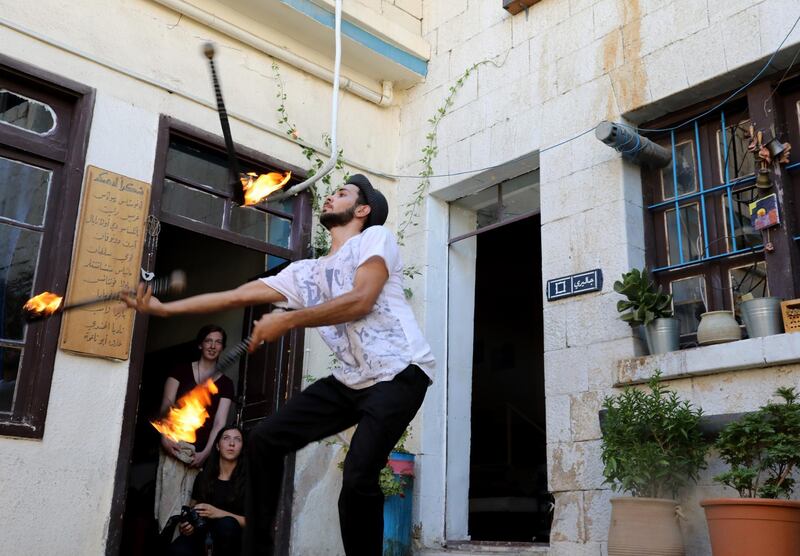 Syrian Esam Al-Khoja performs during a support show for the Cabaret Circus of Amman, held at Jadal Cafe, downtown Amman, Jordan. EPA