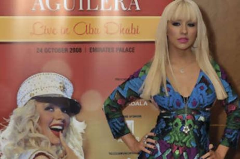 Christina Aguilera, seen, during a press conference at the Emirates Palace Hotel, in Abu Dhabi, United Arab Emirates, Thursday, Oct. 23, 2008. (AP Photo/Carl Abrams) *** Local Caption ***  ABU102_Emirates_Christina_Aguilera.jpg