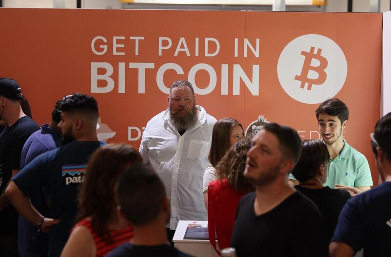 MIAMI, FLORIDA - JUNE 04: Dave Pope (C), works in the Digifox booth setup at the Bitcoin 2021 Convention, a crypto-currency conference held at the Mana Convention Center in Wynwood on June 04, 2021 in Miami, Florida. The crypto conference is expected to draw 50,000 people and runs from Friday, June 4 through June 6th.   Joe Raedle/Getty Images/AFP
== FOR NEWSPAPERS, INTERNET, TELCOS & TELEVISION USE ONLY ==
