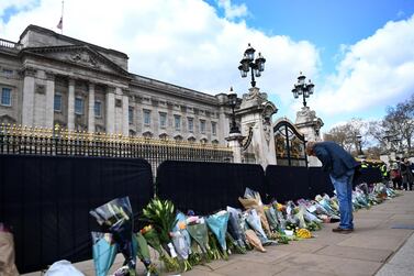 Flowers are placed as tributes outside Buckingham Palace, following the death of Britain's Prince Philip in London. His funeral is planned for 17 April. EPA/ANDY RAIN