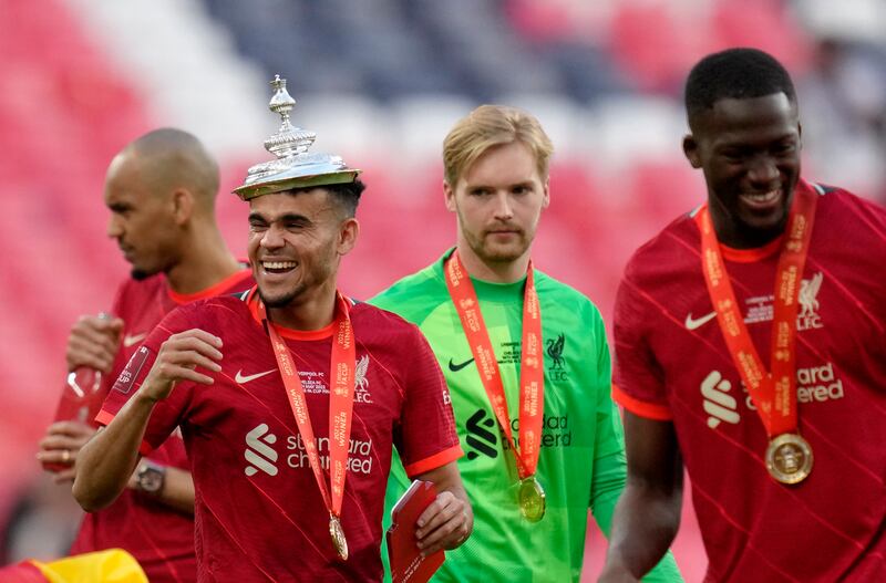 Liverpool players celebrate at the end of the FA Cup final. AP