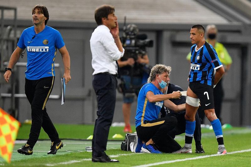 Alexis Sanchez receives treatment. AFP