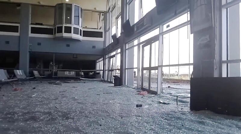 Glass and debris covers the damaged portion of the airport in Yemenâ€™s southern city of Aden after an explosion, Wednesday, Dec. 30, 2020. The blast struck the airport building shortly after a plane carrying the newly formed Cabinet landed on Wednesday. No one on the government plane was hurt.  (AP Photo)