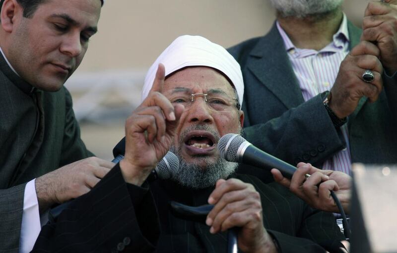Egyptian cleric Youssef Al Qaradawi speaks to the crowd as he leads Friday prayers in Tahrir Square in Cairo, Egypt on February 18,2011. Khalil Hamra / AP