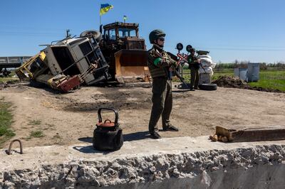 Ukrainian soldiers stand watch near front-line positions in Zelenodolsk, Ukraine. Getty Images