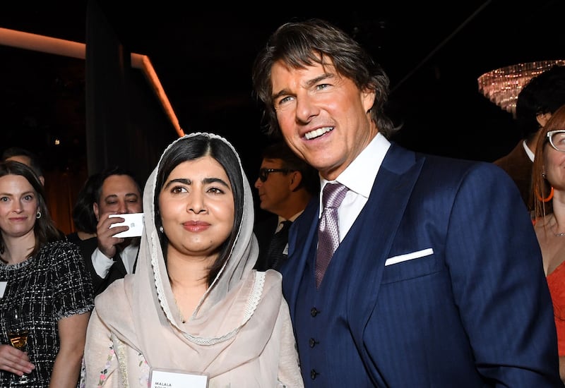 Pakistani activist Malala Yousafzai (L) and US actor Tom Cruise arrive at the 95th Annual Oscars Nominees Luncheon at The Beverly Hilton on February 13, 2023 in Beverly Hills, California.  (Photo by VALERIE MACON  /  AFP)