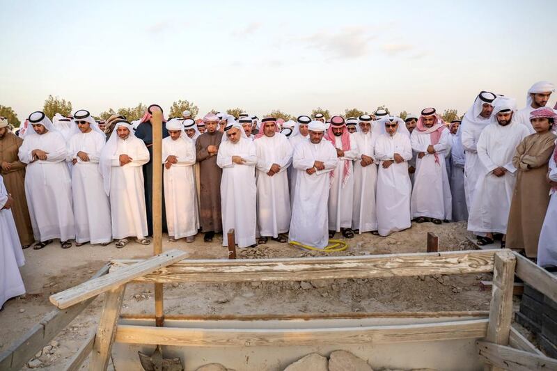 Abdulhamid Al Hammadi is laid to rest at Baniyas Cemetery on Saturday afternoon. Victor Besa for The National