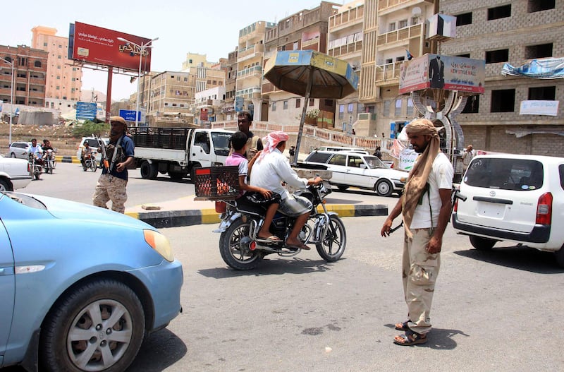 Yemeni security forces inspect vehicles at a checkpoint in Mukalla, the capital of Yemen's southeastern Hadramawt province. AFP