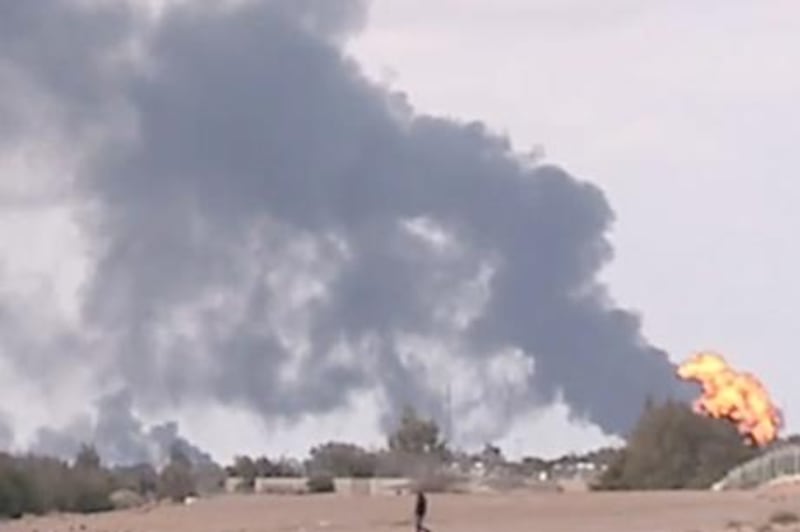 A burning oil facility near Ras Lanuf, eastern Libya, set alight as forces loyal to Muammar Qaddafi and rebels clashed.