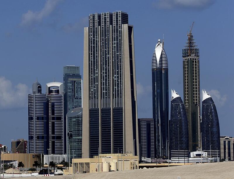 Emirates REIT owns a part of Index Tower, centre, a mixed-use property located in the DIFC. Satish Kumar / The National