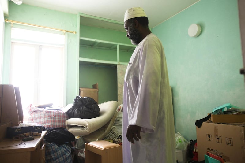 Dubai, UAE, July 8, 2012:
Ahmed Omar, a native of Sudan, is seen here, inside of his aprtment He has been living inside of the Sheikh Rashid Colony (also known as the 7,000 building because of its original rental price) for 11 and a half years. He doesn't know where he and his family will go yet. 

The residents of the area were told on June 1st via text message that they would have to vacate their homes by mid july at the very latest. 

Lee Hoagland/The National