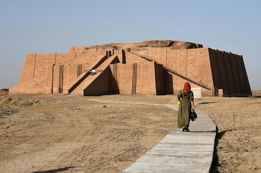 An woman walks towards the Great Ziggurat temple in Iraq. The massive Sumerian stepped mudbrick construction, dedicated to the moon god Nanna, was first built more than 4,000 years ago. AFP
