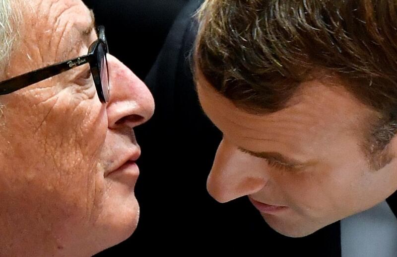 French President Emmanuel Macron talks with European Commission President Jean-Claude Juncker  in Brussels, Belgium. Reuters