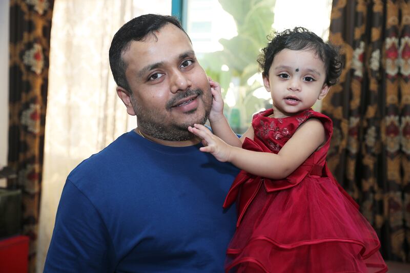 Chandan Sahu with his 18-month-old daughter Deetya at his home in Dubai. Pawan Singh / The National