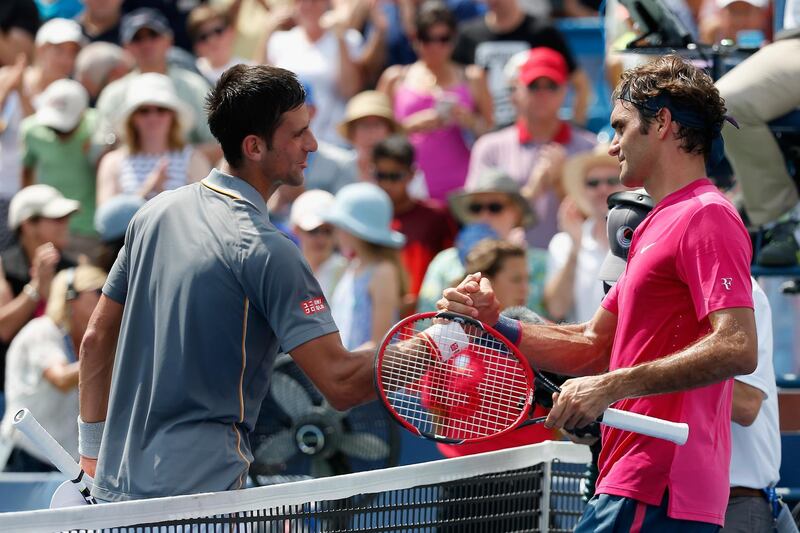 CINCINNATI, OH - AUGUST 23:  Roger Federer of Switzerland (R) shakes hands with Novak Djokovic of Serbia after defeating him in two sets to win the mens singles final at the Western & Southern Open at the Linder Family Tennis Center on August 23, 2015 in Cincinnati, Ohio.  (Photo by Rob Carr/Getty Images)