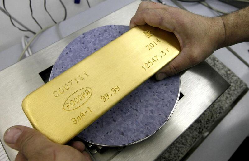 An ingot of 99.99 per cent pure gold. The yellow metal's price has declined. Ilya Naymushin / Reuters