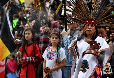 (FILES) In this file photo Native Americans lead demonstrators as they march to the Federal Building in protest against President Donald Trump's executive order fast-tracking the Keystone XL and Dakota Access oil pipelines, in Los Angeles, California on February 5, 2017. President-elect Joe Biden plans to scrap the permit for the controversial Keystone XL oil pipeline between Canada and the US, two Canadian broadcasters said on January 17, 2021. CBC and CTV cited sources and notes from Biden's transition team that indicate he will rescind the permit via executive order following his inauguration on January 20, 2021. / AFP / Mark RALSTON
