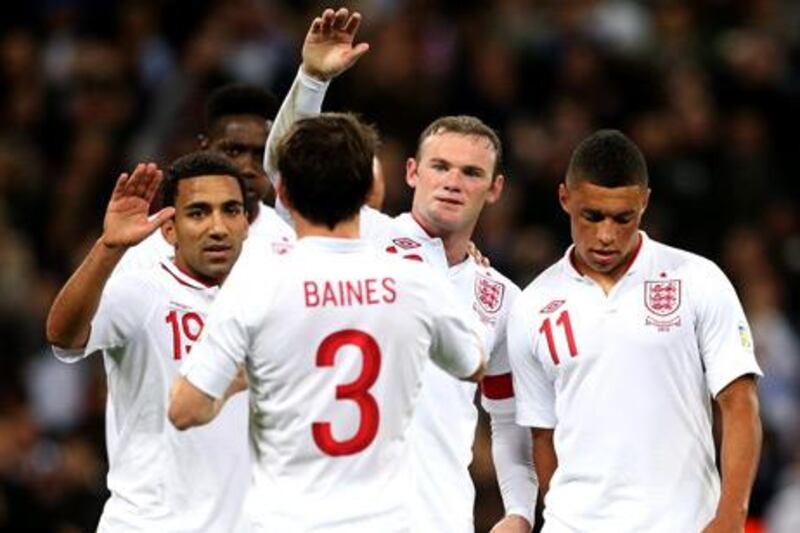 England captain Wayne Rooney celebrates with his teammates after scoring against San Marino