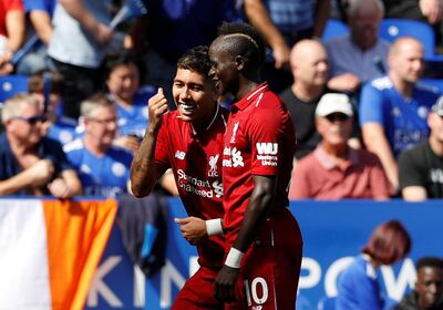 Soccer Football - Premier League - Leicester City v Liverpool - King Power Stadium, Leicester, Britain - September 1, 2018  Liverpool's Roberto Firmino celebrates scoring their second goal with Liverpool's Sadio Mane    REUTERS/Darren Staples  EDITORIAL USE ONLY. No use with unauthorized audio, video, data, fixture lists, club/league logos or "live" services. Online in-match use limited to 75 images, no video emulation. No use in betting, games or single club/league/player publications.  Please contact your account representative for further details.