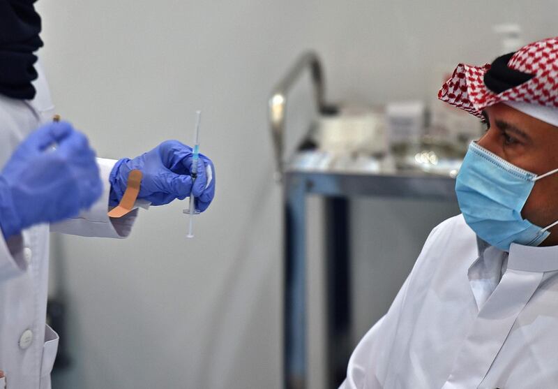 The first Saudi citizen prepares to receive the Pfizer-BioNTech vaccine (Tozinameran) in the capital Riyadh. AFP