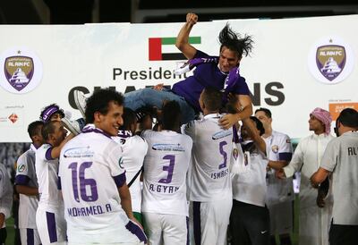 Al Ain players lift their manager Zlatko Dalic after winning the 2014 President's Cup. Pawan Singh / The National