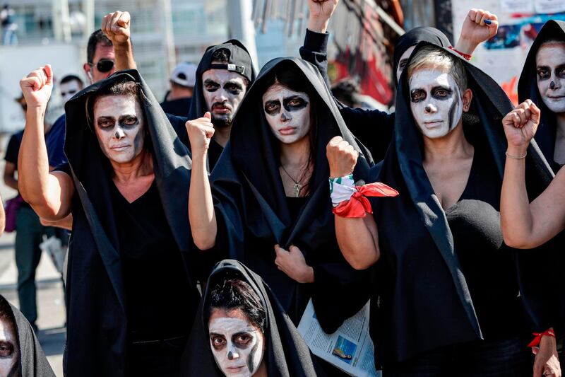 Lebanese anti-government protesters take part in a symbolic funeral for the country in the  capital Beirut on June 13, 2020, the third consecutive day of demonstrations over a deepening economic crisis.  AFP