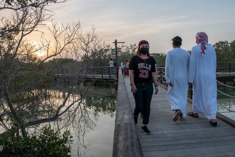 Visitors at Jubail Mangrove Park. Schools and businesses are planting saplings as part of the UAE's campaign.