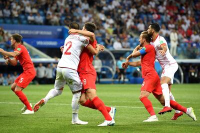 VOLGOGRAD, RUSSIA - JUNE 18:  Harry Kane of England and Yassine Meriah of Tunisia clash during the 2018 FIFA World Cup Russia group G match between Tunisia and England at Volgograd Arena on June 18, 2018 in Volgograd, Russia.  (Photo by Matthias Hangst/Getty Images)