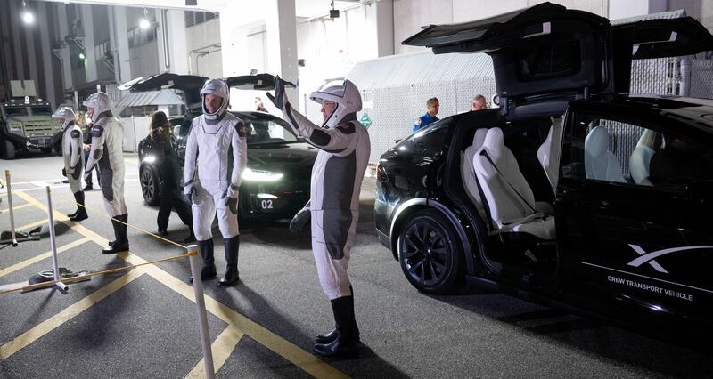 The crew get into their Teslas to go to the launch pad as part of a rehearsal. Photo: Nasa 