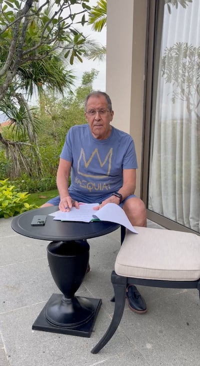 Russian Foreign Minister Sergei Lavrov reads documents on a patio in Bali, Indonesia, in this still image taken from video uploaded on the Telegram channel of Foreign Ministry Spokeswoman Maria Zakharova on November 14, 2022.  Maria Zakharova via Telegram/Handout via REUTERS ATTENTION EDITORS - THIS IMAGE WAS PROVIDED BY A THIRD PARTY.  NO RESALES.  NO ARCHIVES.  MANDATORY CREDIT.  MUST CREDIT MARIA ZAKHAROVA VIA TELEGRAM. 